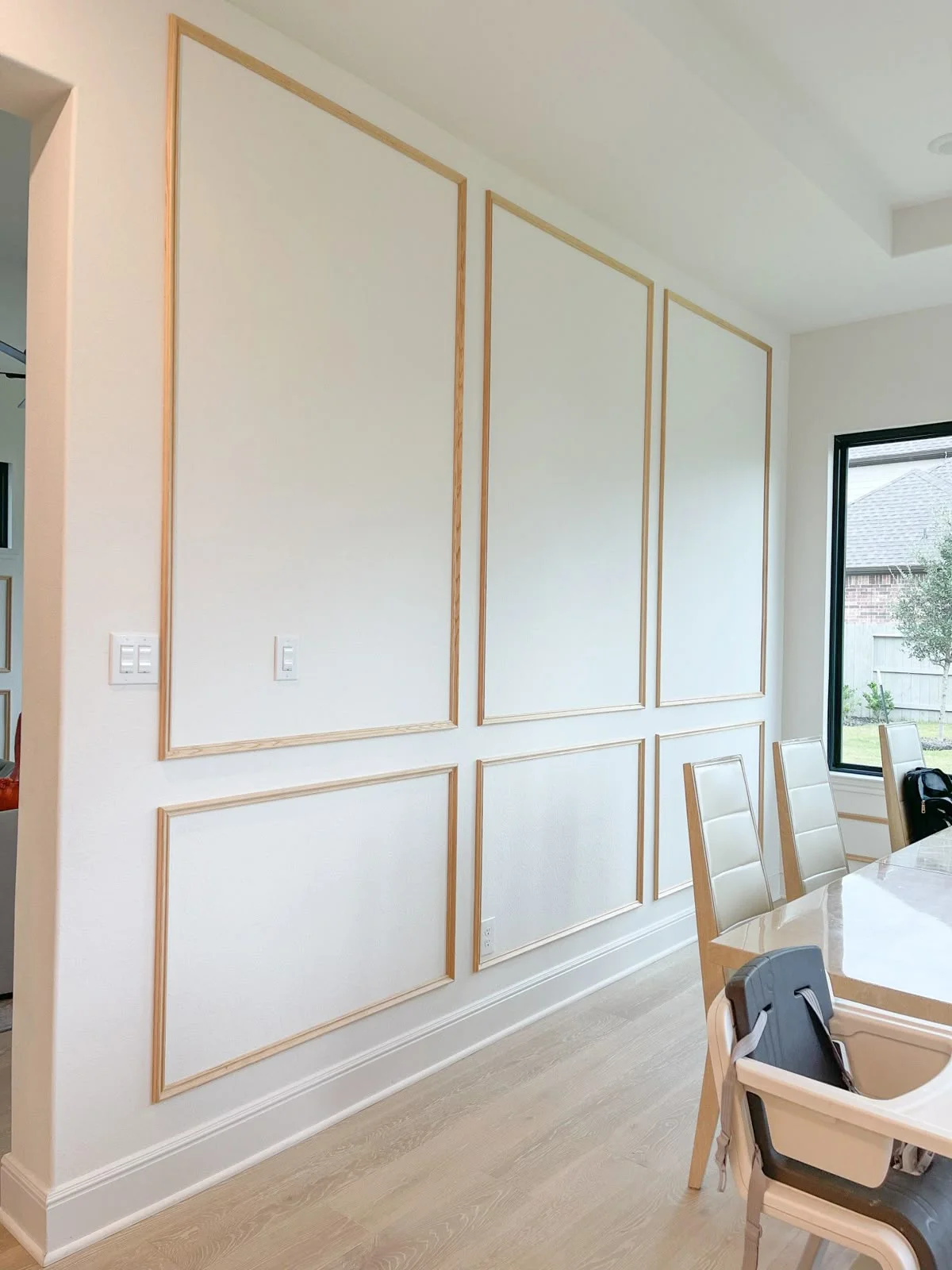 Minimalist Gold-Trim Wainscoting